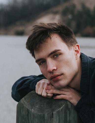 human man lying on tree branch person