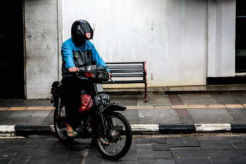 human man riding motorcycle motorcycle