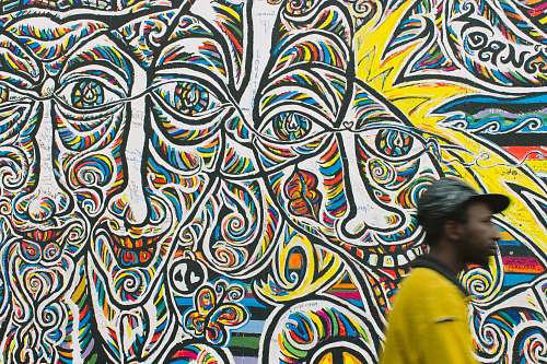 human man standing near graffiti art person