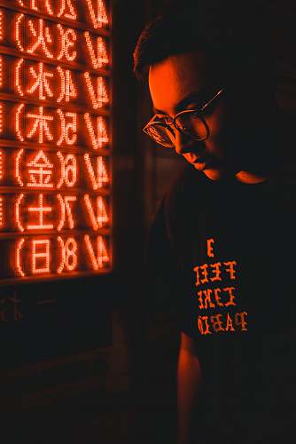 human man standing near LED signage person
