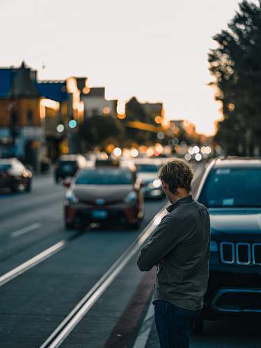 car man standing near vehicle vehicle