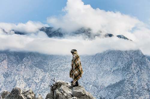 human man standing on mountain person