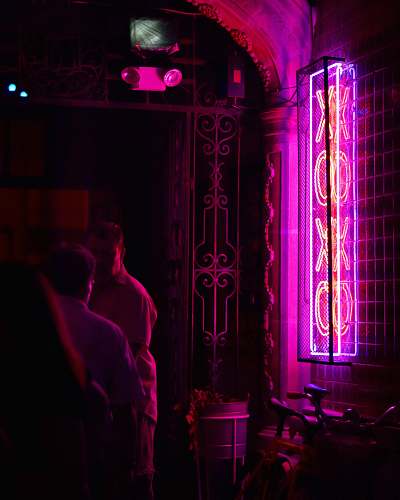 human man standing on neon light person