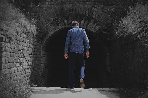 human man walking to tunnel person