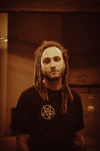 human man wearing black crew-neck t-shirt person