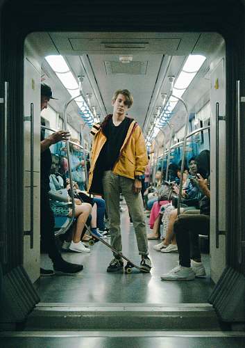 human man wearing gray pants inside train person