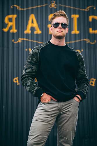person men's black and green sweatshirt human