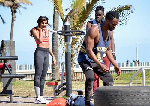 person men's blue tank top and black sweatpants human