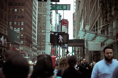 person people at W36 street near brown buildings during daytime human
