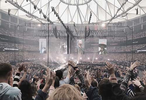 human people inside stadium crowd