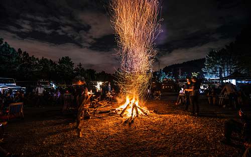 human people standing next to bonfire person