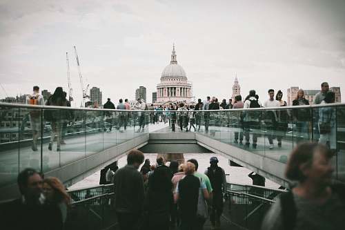 human people walking in front of white concrete dome building during daytime person