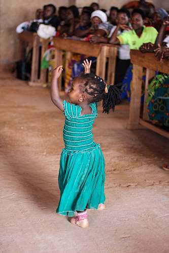human people watching dancing girl wearing blue dress person