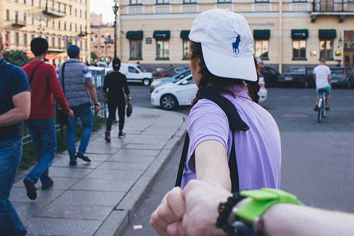human person holding another person's hand person