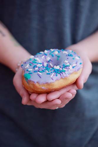 human person holding doughnut person