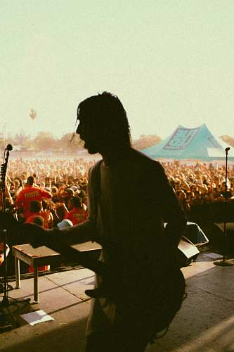 person person holding guitar human