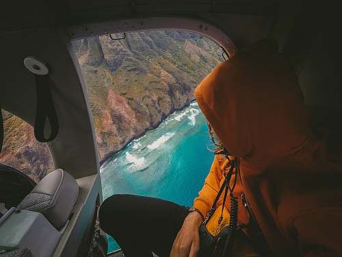 person person in aircraft and looking down travel
