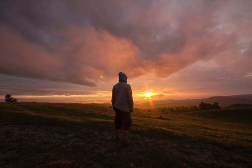 person person standing in front of sunset human