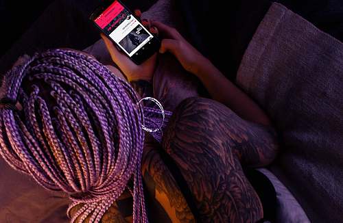 human person using black smartphone person