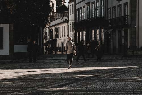 human person walking on road person