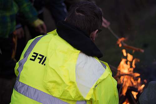 human person wearing yellow and gray high visibility vest person