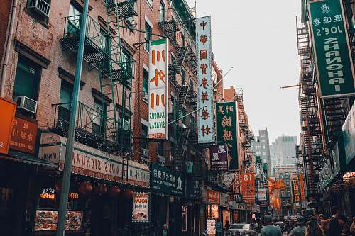human photo of Kanji script signage in buildings during daytime person
