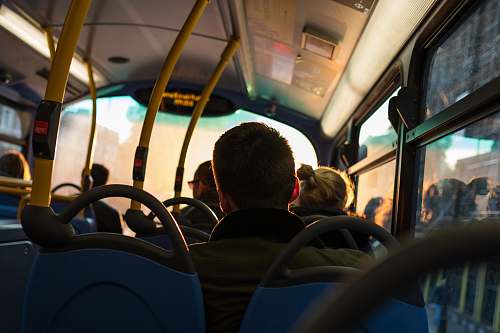 human photo of man sitting inside bus person