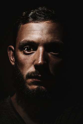 human photography of man face in dimmed room person
