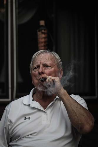 human selective focus photography of man using tobacco person
