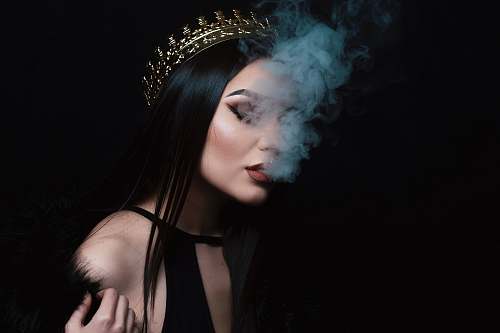 human smoke coming out from woman's mouth person
