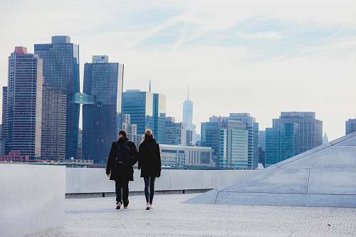human two people walking on rooftop person
