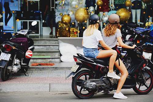 motorcycle two women riding motorcycle transportation