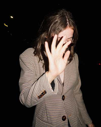 human woman covering her face person