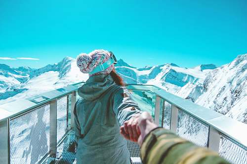 person woman facing backwards near mountains nature