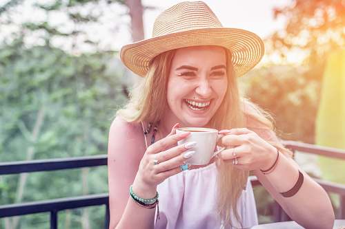 human woman holding coffee mug person