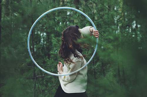 human woman holding hulahoop person