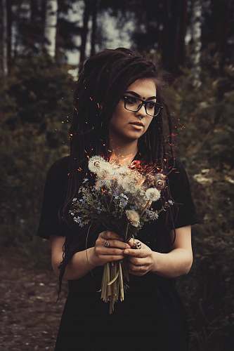 human woman holding white flowers person