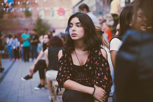 human woman in black and red floral shirt person