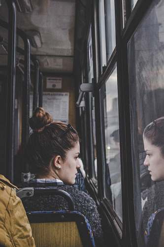 person woman in gray top sitting on passenger seat human