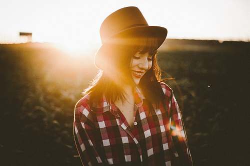 girl woman in white and red checkered dress shirt hat