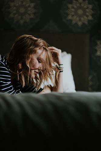 human woman laying down on bed person