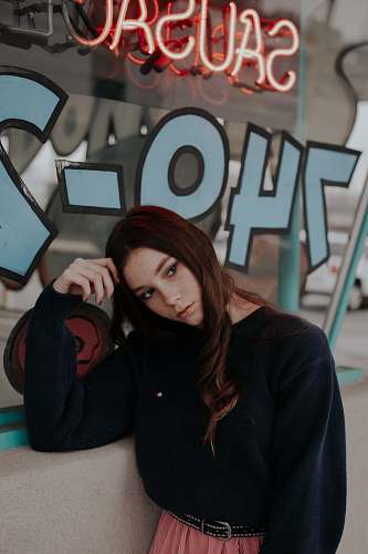 human woman lean on wall and glass window person