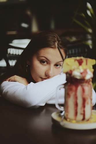person woman leaning on table human