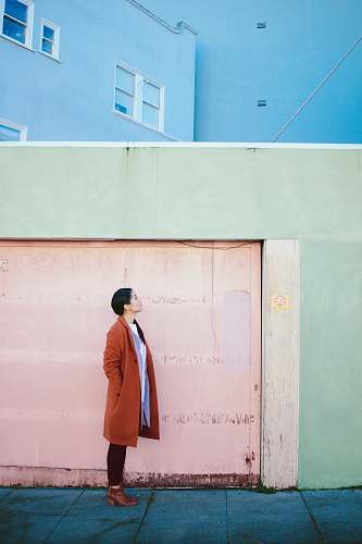 human woman looking up in front of garage door person
