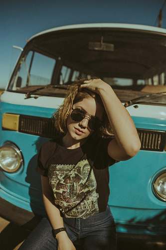 human woman person in front of vehicle person
