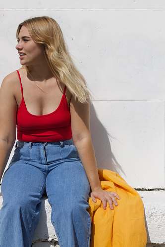 human woman sitting on bench person
