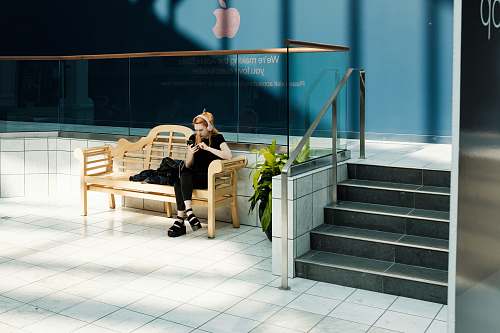 person woman sitting on bench flora