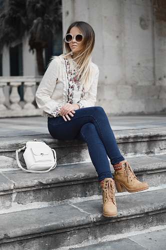 human woman sitting on gray concrete stair person