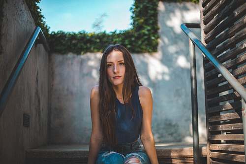 person woman sitting on stair human