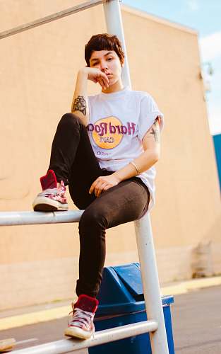 human woman sitting on white scaffolding person